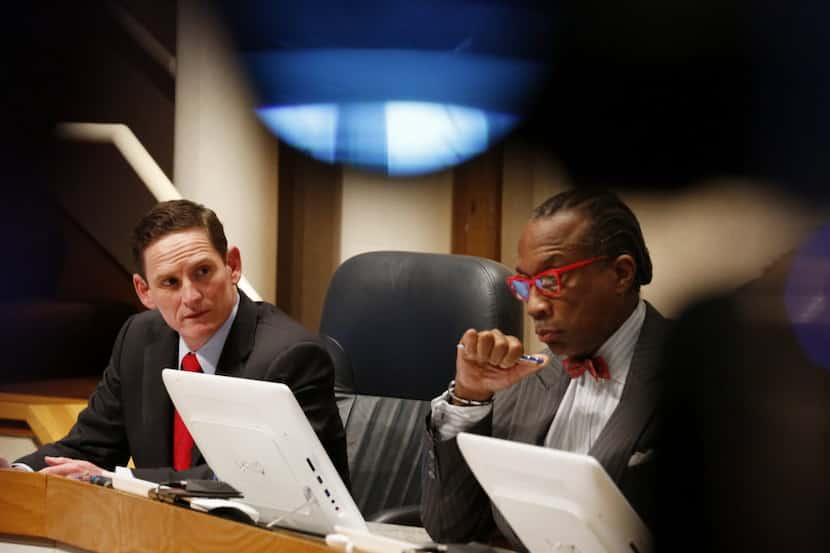 Dallas County Judge Clay Jenkins and Commissioner John Wiley Price listen to District 4...