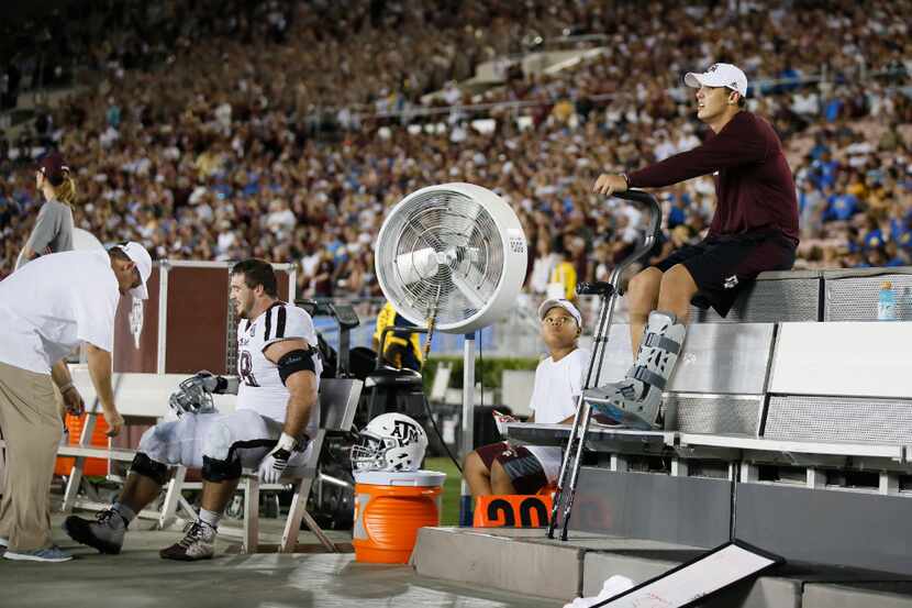 Texas A&M quarterback Nick Starkel sits on the bench with an injury after leaving the game...