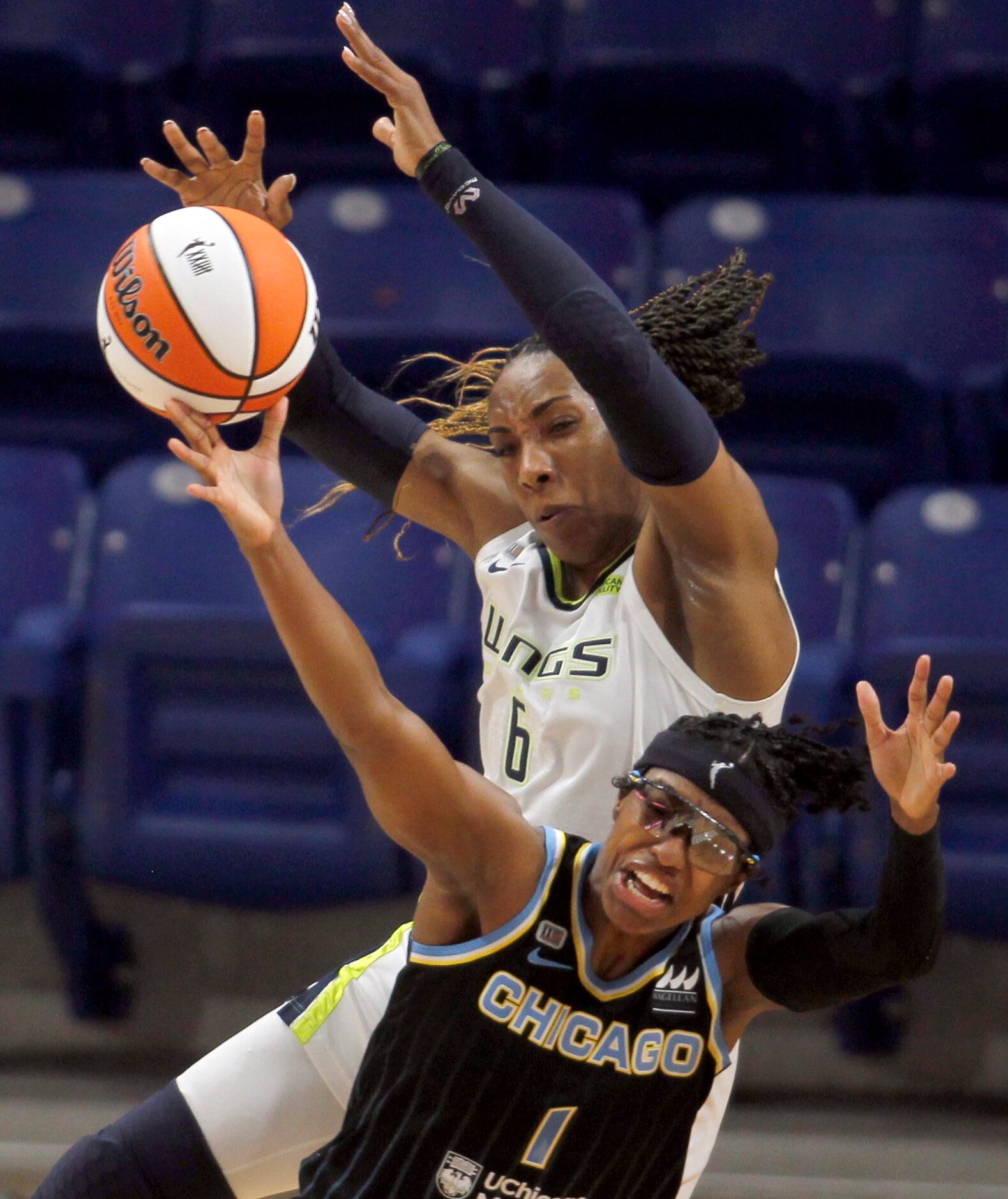 Dallas Wings forward Kayla Thornton (6) battles Chicago Sky guard Diamond DeShields (1) for...