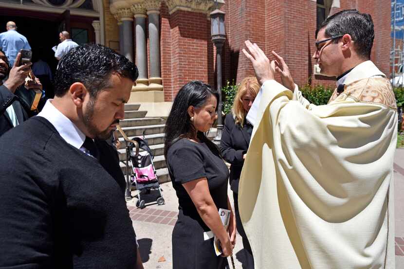 Democratic state Rep. Victoria Neave of Dallas received a blessing after Mass on Sunday from...
