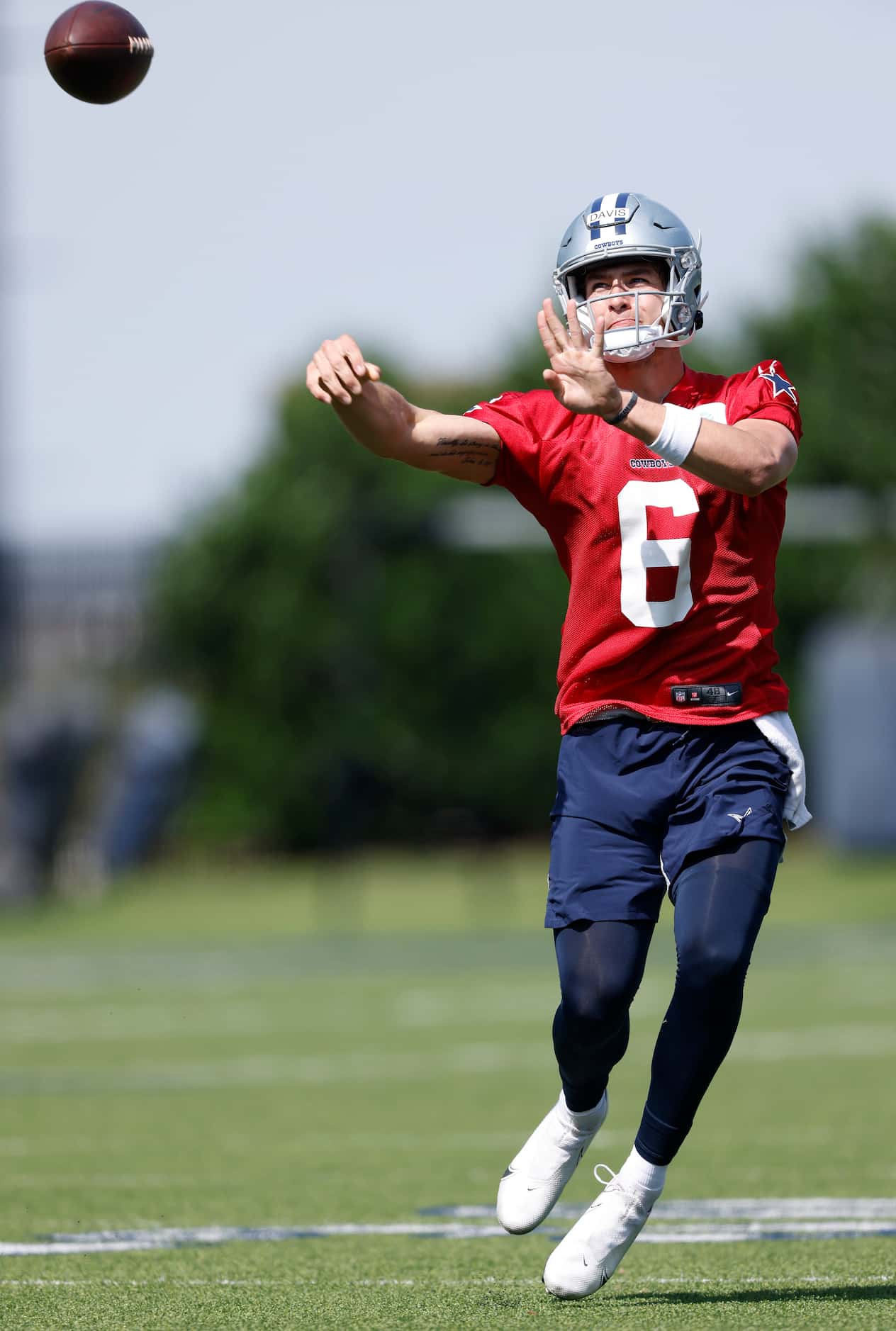 Dallas Cowboys rookie quarterback Brady Davis (6) throws o the run during rookie minicamp at...