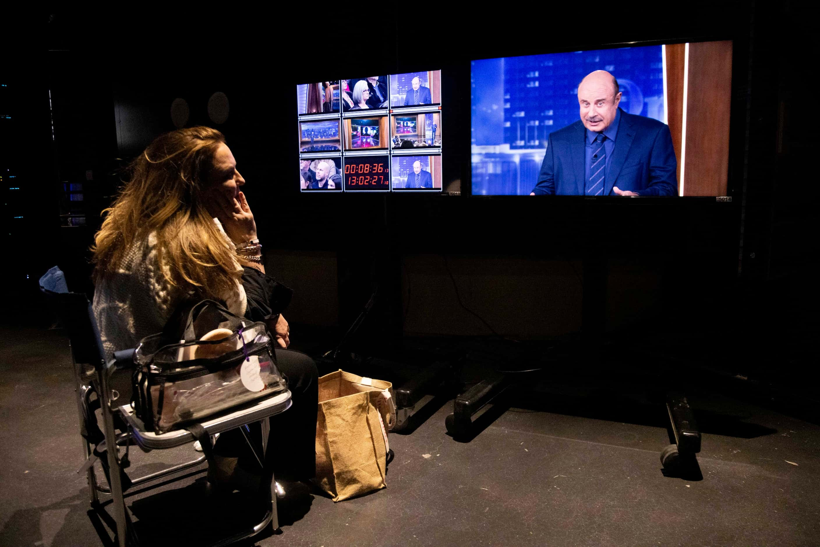 Makeup artist Heather Currie watches from backstage as Phil McGraw, better known as Dr....