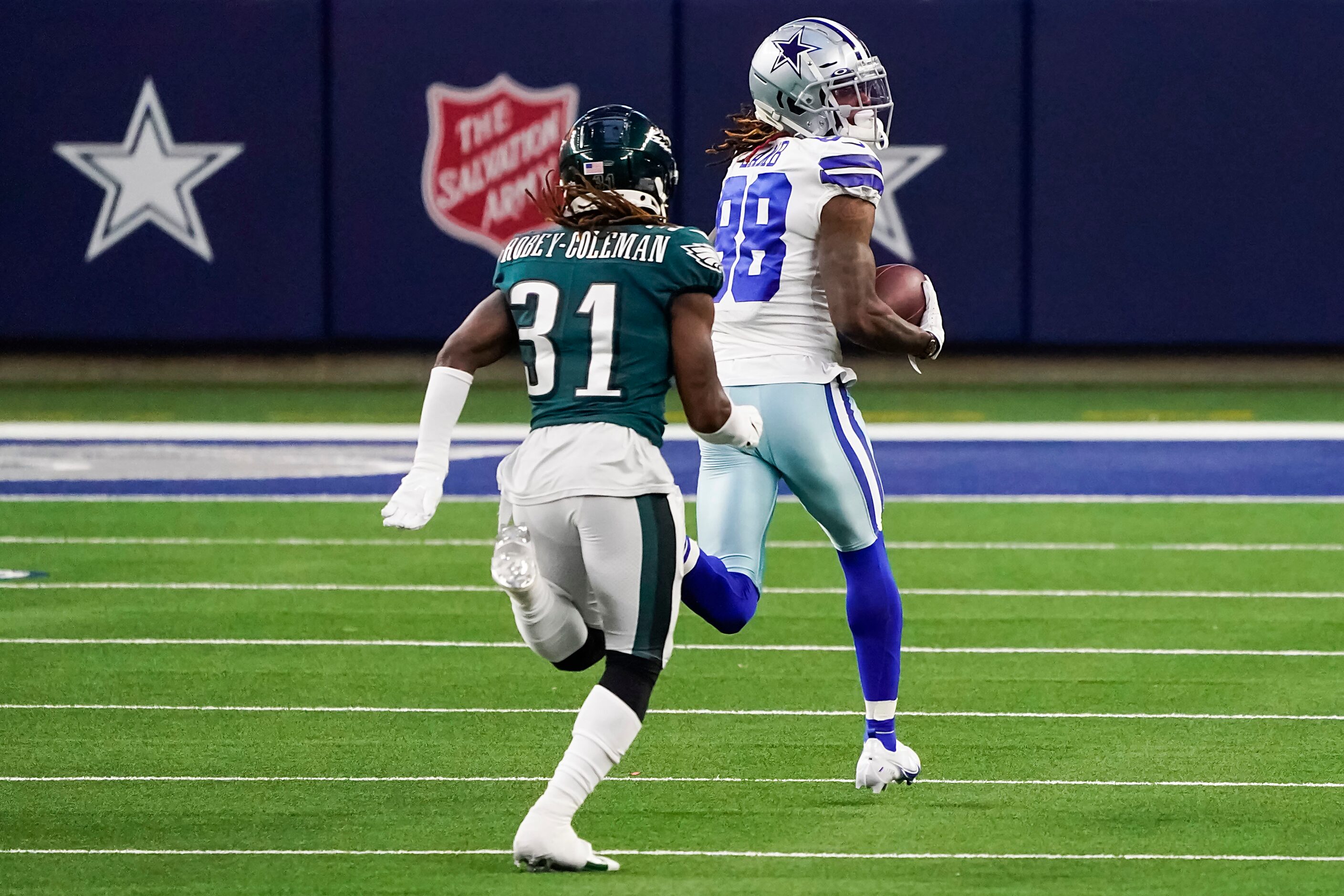 Dallas Cowboys wide receiver CeeDee Lamb (88) races past Philadelphia Eagles cornerback...