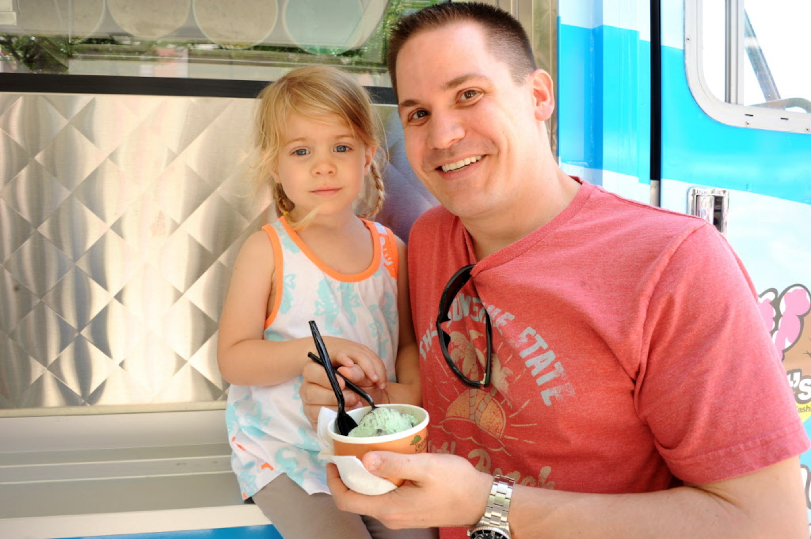 Mike Skorey and four-year-old daughter Mady share some mint chocolate chip ice cream from...