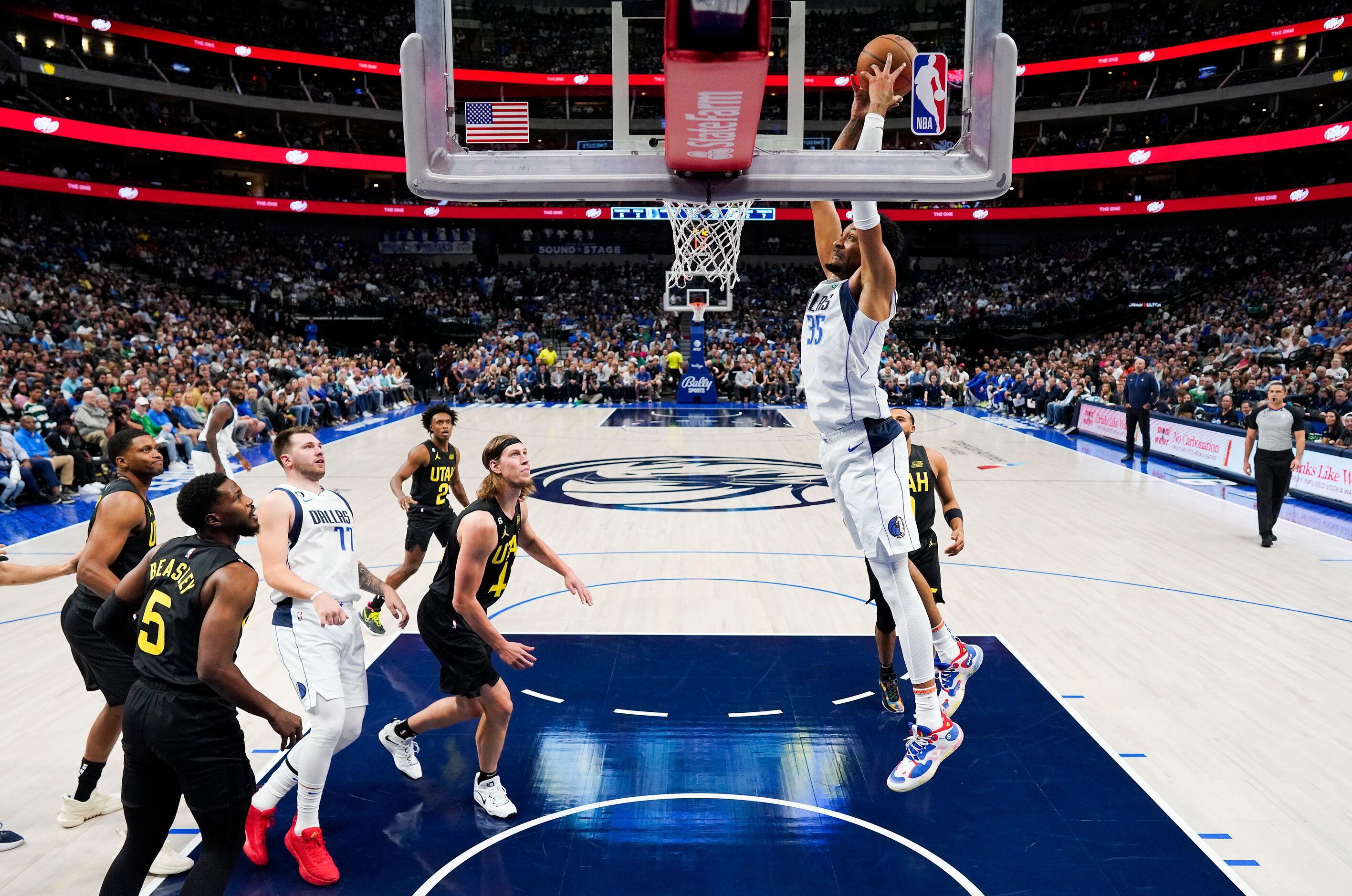 Dallas Mavericks center Christian Wood (35) dunks the ball on an alley-oop from guard Luka...