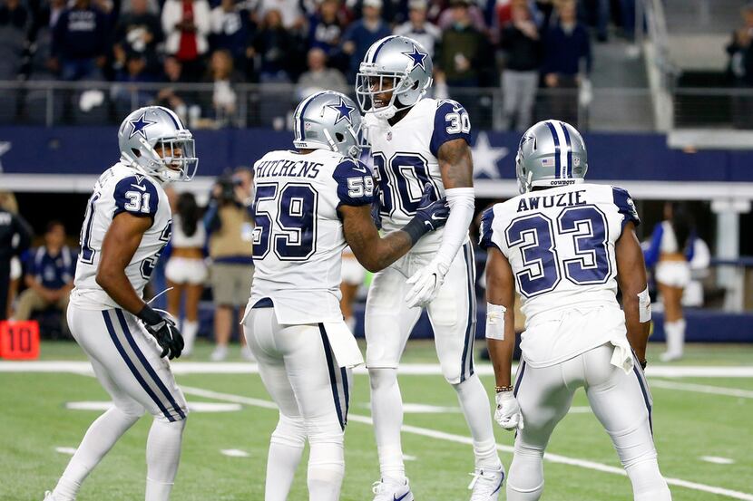 Dallas Cowboys cornerback Anthony Brown (30) celebrates his interception with middle...