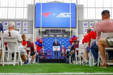 SMU President R. Gerald Turner (center) speaks during a press conference announcing  SMU’s...