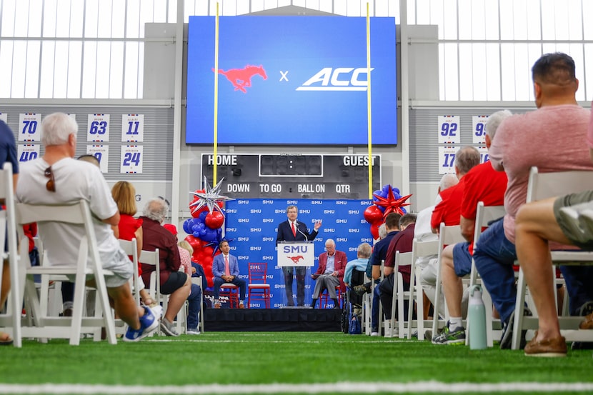 SMU President R. Gerald Turner (center) speaks during a press conference announcing  SMU’s...