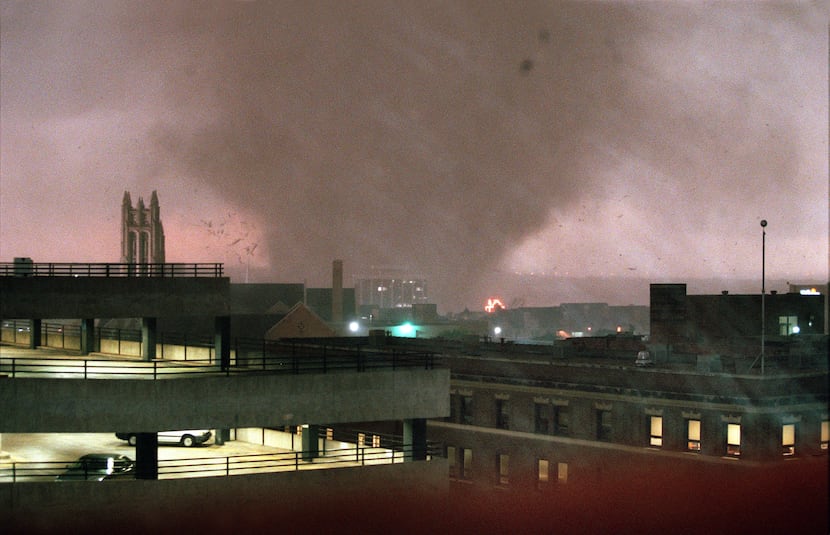 A tornado crosses the Trinity River on the west side of Fort Worth and heads for downtown on...