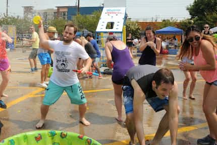 Anthony Delabano picks a target for his balloon at the Deep Ellum Water Balloon Wars  on...