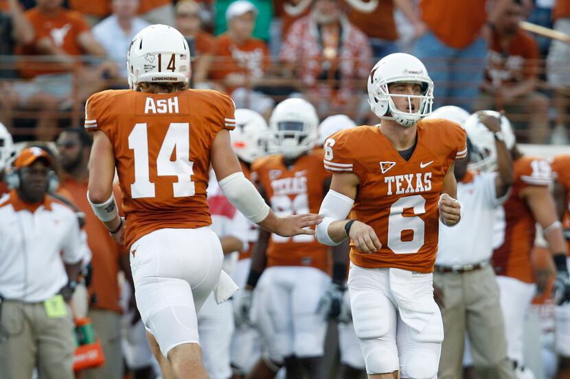 In this Sept. 10, 2011 file photo, Texas quarterbacks David Ash (14) and Case McCoy (6) pass...