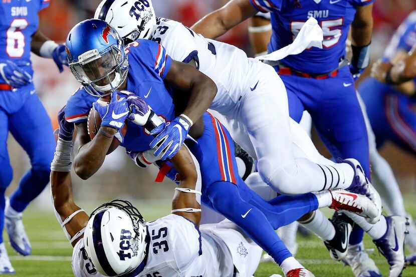 Southern Methodist Mustangs wide receiver James Proche (3) is tackled by TCU Horned Frogs...