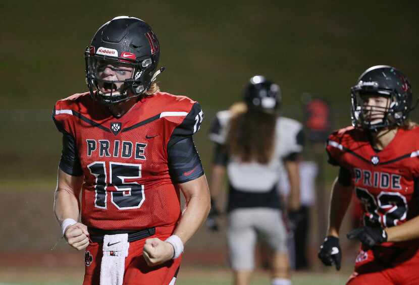Colleyville Heritage quarterback Cam Roane (15) celebrates a touchdown pass to wide receiver...
