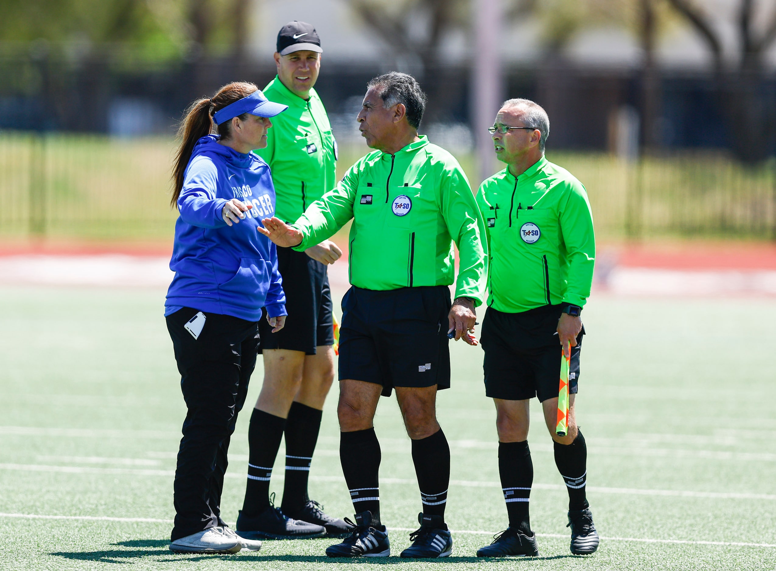 Frisco girls soccer head coach Jaime Leraas, left, argues a call during the Class 5A Region...