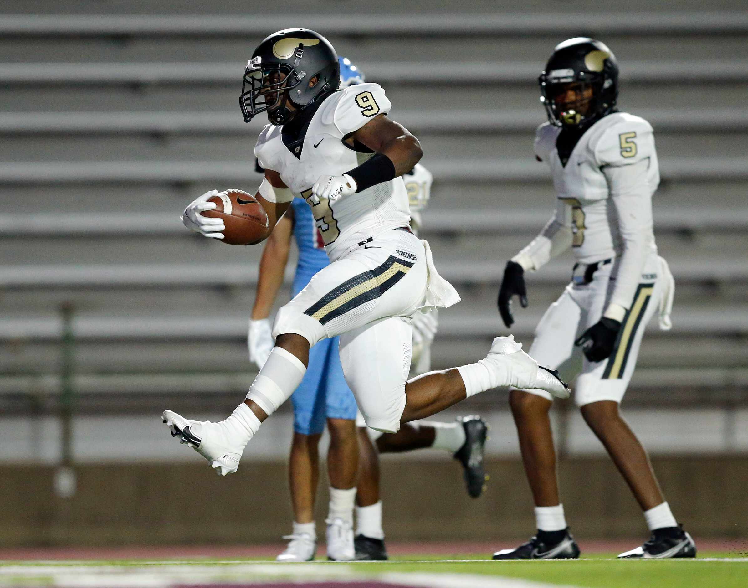 Pinkston running back Ronnie Cooper (9) glides across the goal line, scoring a second half...