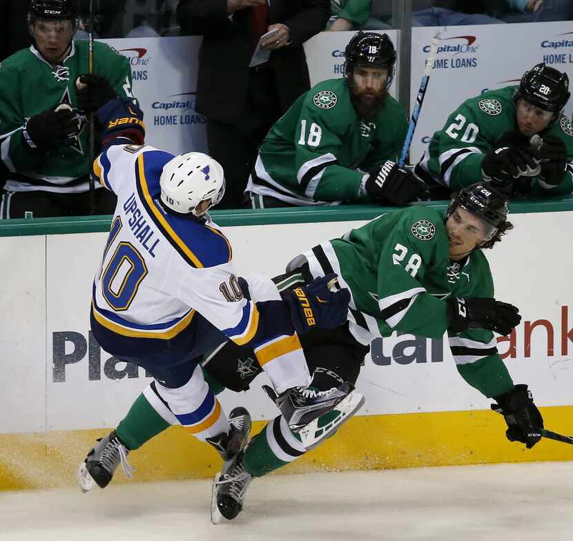 Dallas Stars defenseman Stephen Johns (28) collides with St. Louis Blues right wing Scottie...