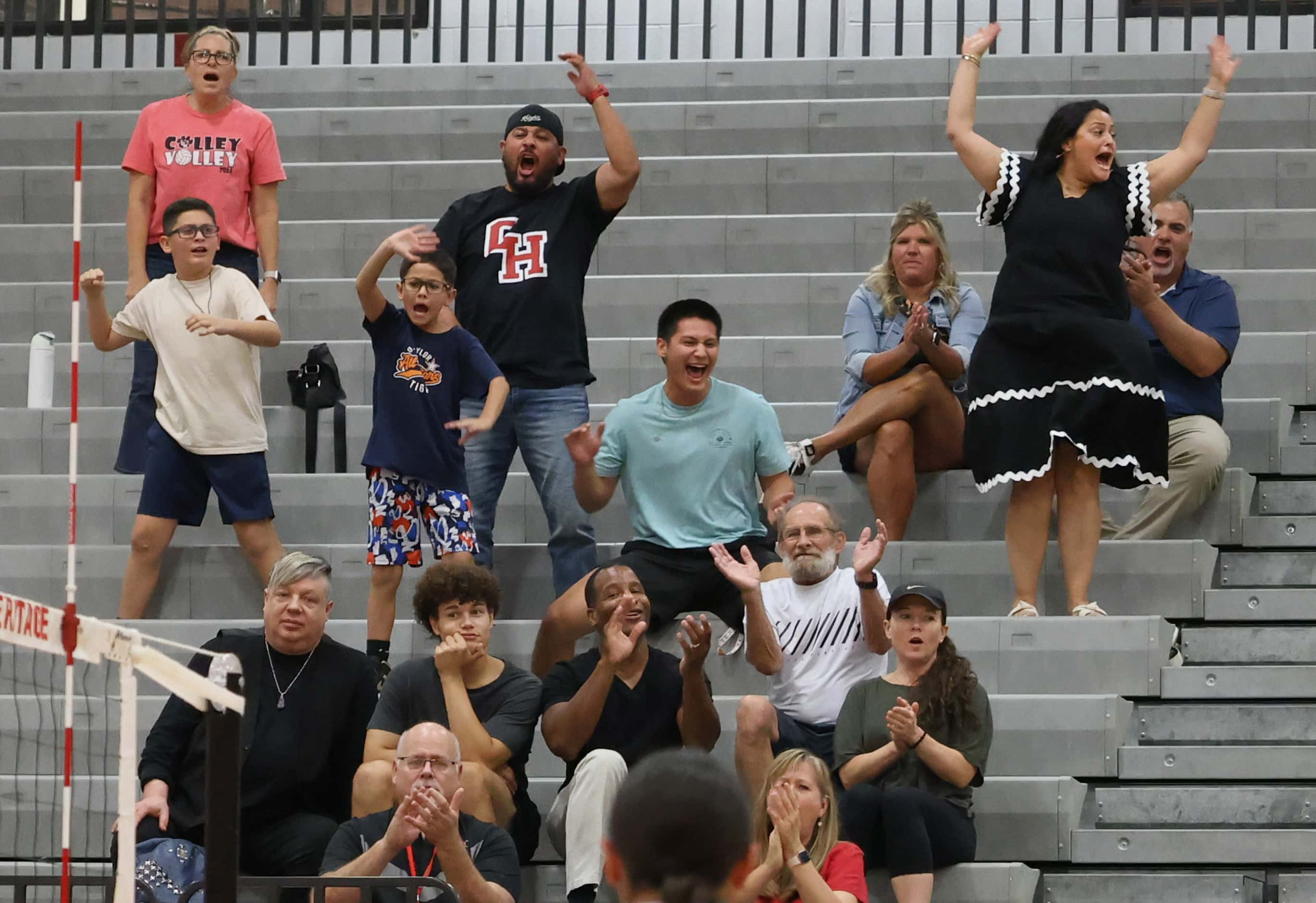 Colleyville Heritage fans react after a critical point scored in the final set of their...