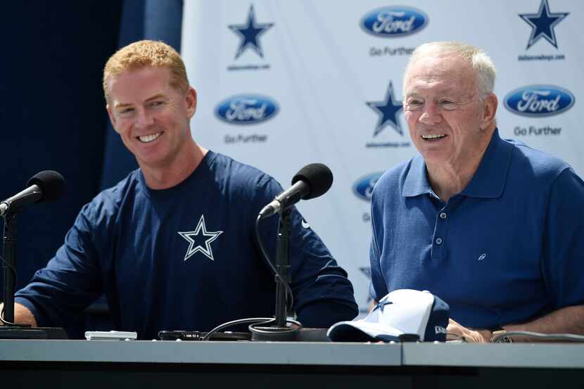 Dallas Cowboys head coach Jason Garrett, left, and owner Jerry Jones speak during the state...