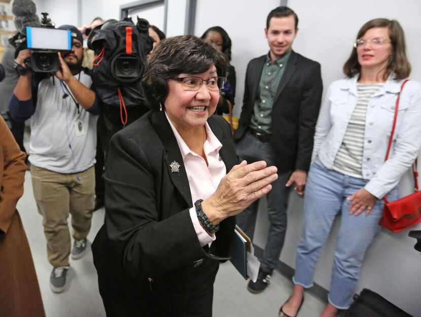 Recently-resigned Dallas County Sheriff Lupe Valdez makes her way through the media to head...