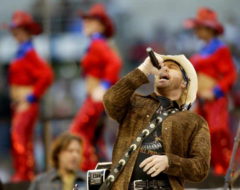 Singer Toby Keith performs at halftime as the Dallas Cowboys host the Miami Dolphins on...