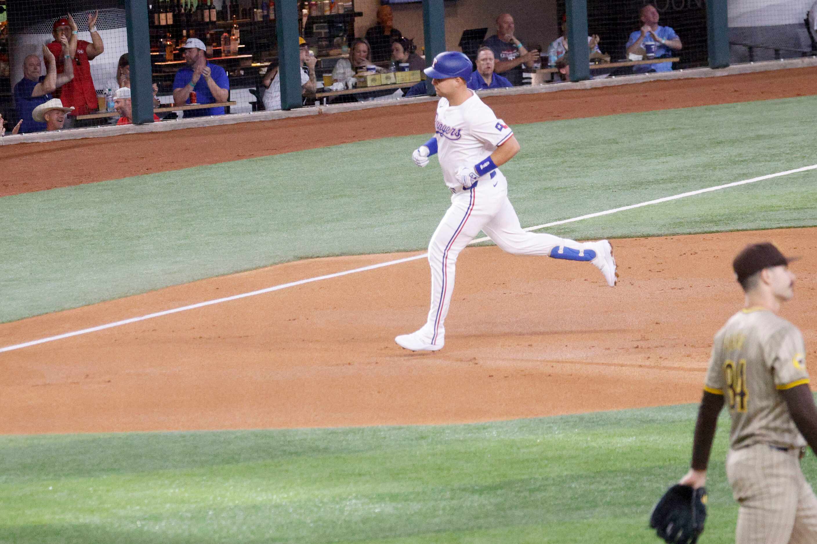 Texas Rangers first base Nathaniel Lowe (30) runs the bases after hitting a home run as San...