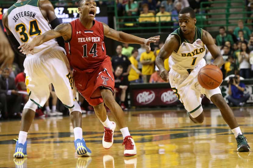 Texas Tech Robert Turner (14) defends against Baylor's Kenny Chery (1) and  Cory Jefferson...