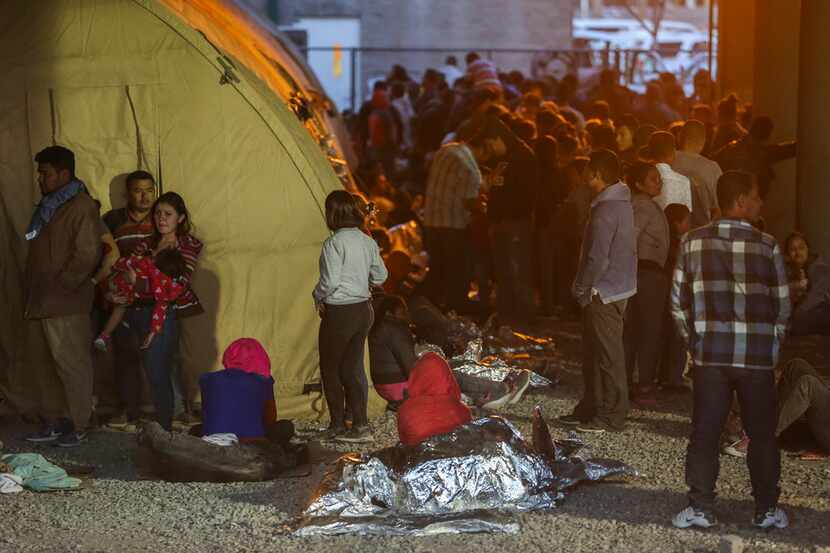 Migrants, including young children and babies, at the U.S. Border Patrol temporary holding...