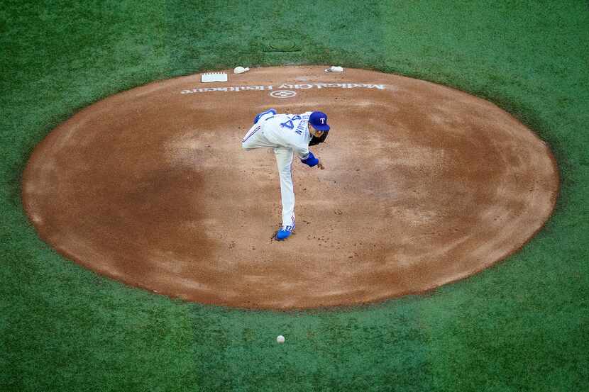 FILE - Rangers starter Kyle Gibson delivers a pitch during the first inning against the...