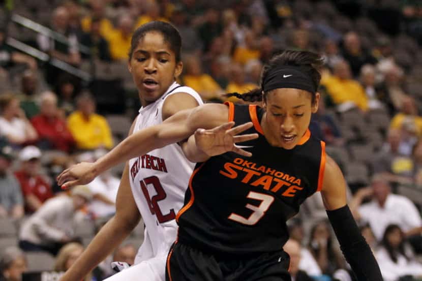 Oklahoma State Cowgirls guard Tiffany Bias (3) drives towards the basket as she is defended...
