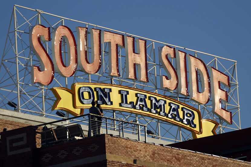 The view of the rooftop of NYLO Dallas South Side (foreground) during the Lamar Street...