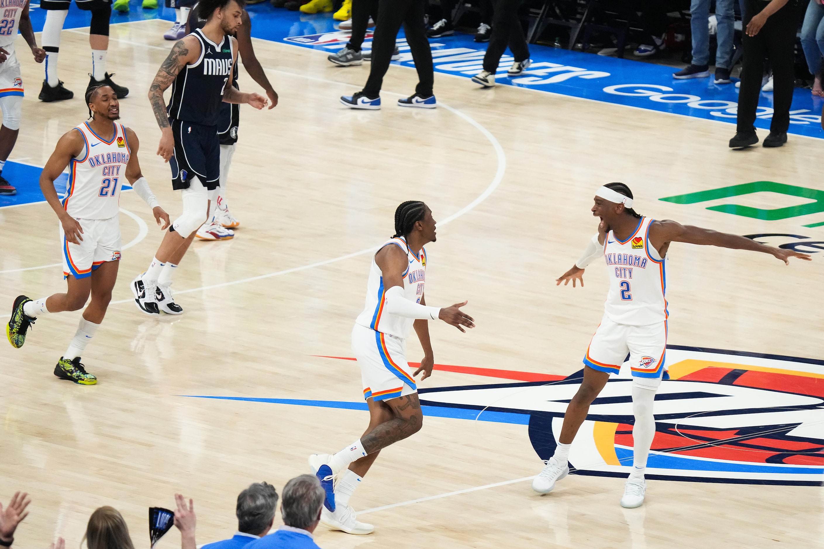 Oklahoma City Thunder guard Shai Gilgeous-Alexander (2) celebrates with forward Jalen...