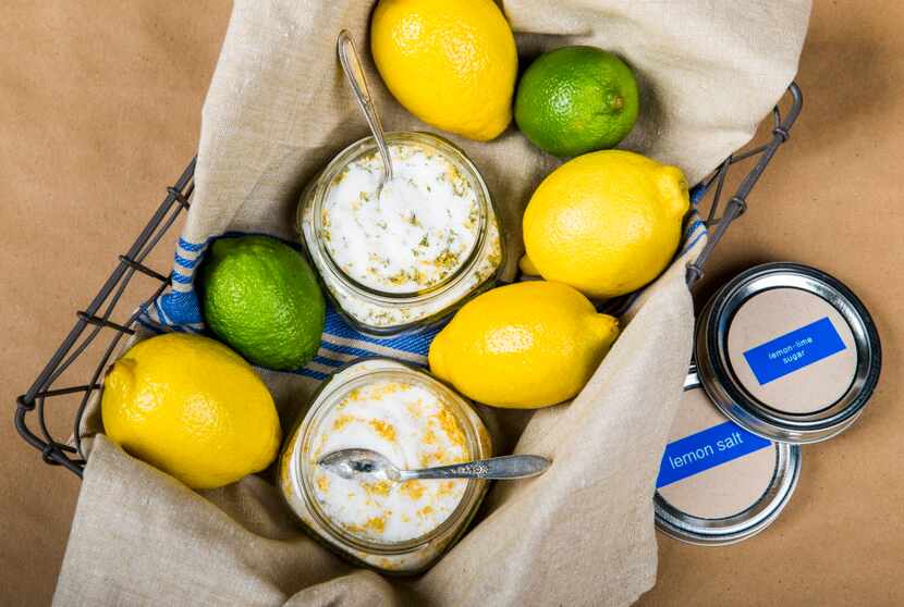 A lemon basket with lemon salt, lemon-lime sugar and fresh lemons and limes.