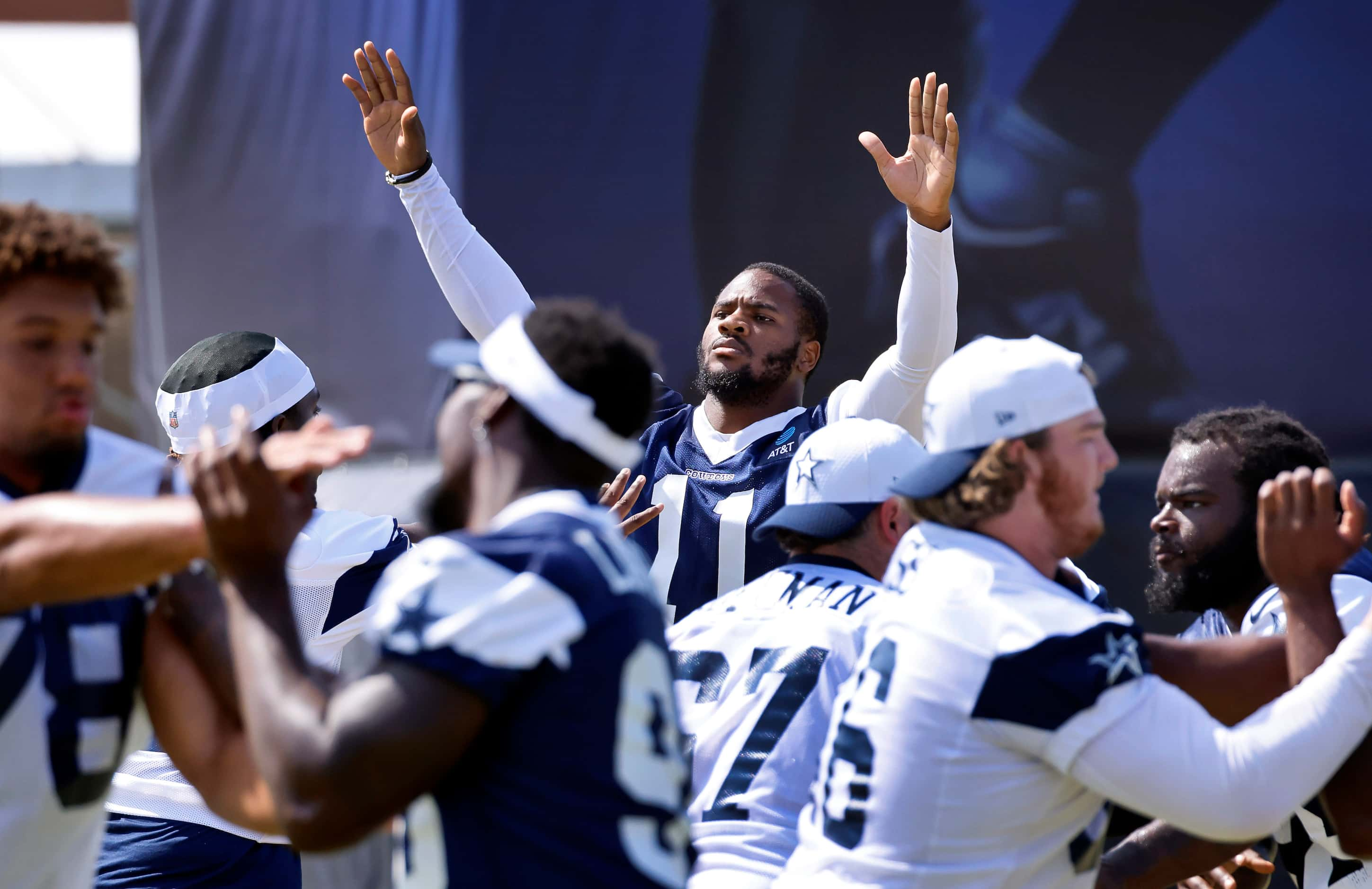 Dallas Cowboys linebacker Micah Parsons (11) raises his arms to block a pass during a mock...