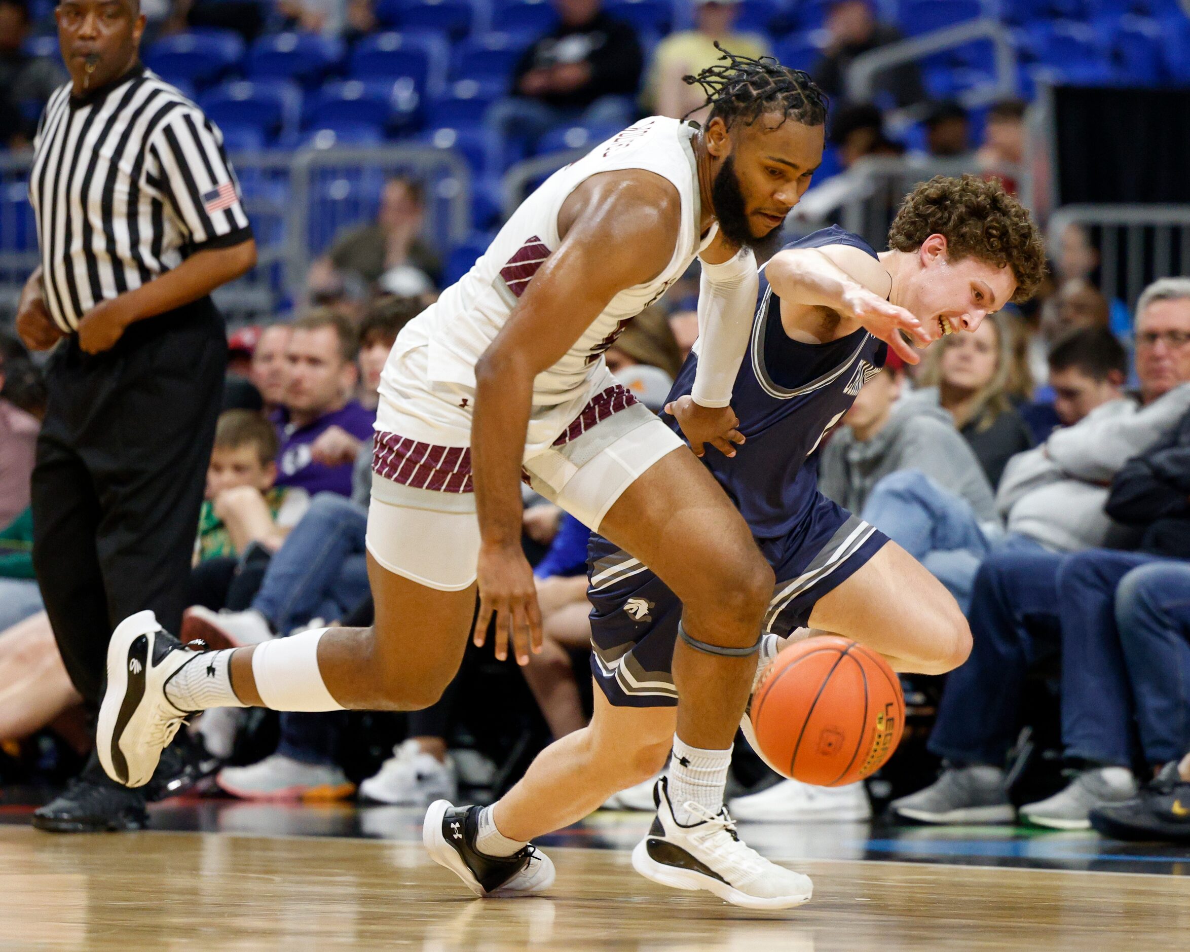 Mansfield Timberview guard Jared Washington (5) steals the ball from Boerne Champion guard...