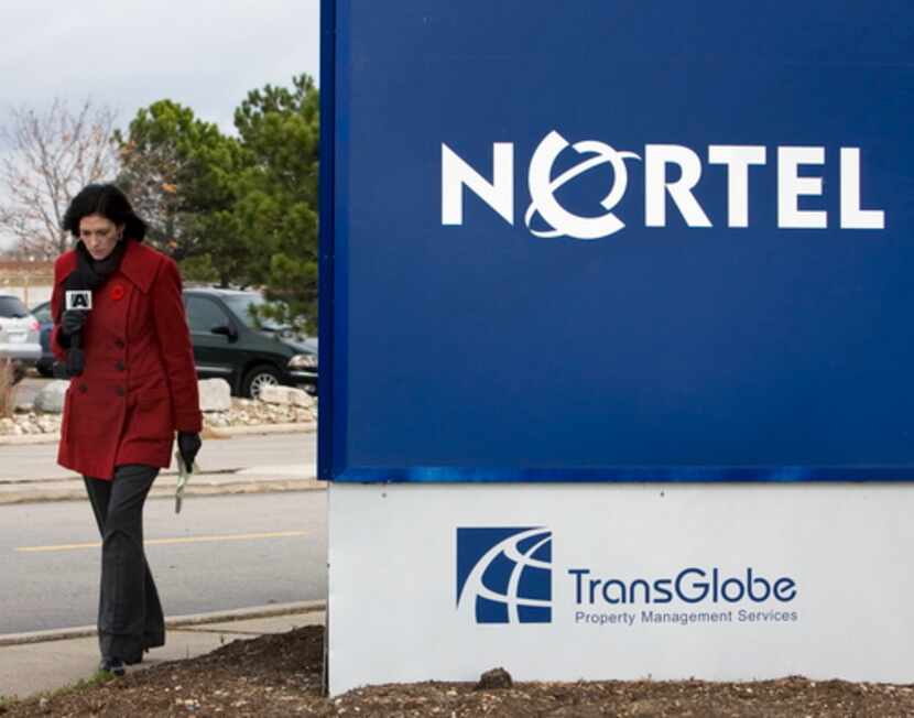  A news reporter walked past the Nortel office tower sign  in 2008 in Etobicoke, Ont. 