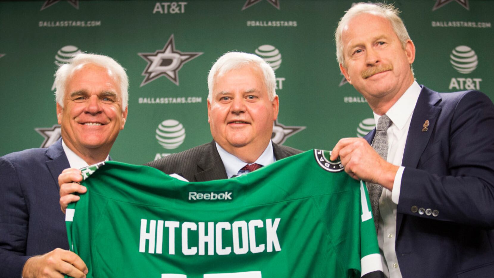 Ken Hitchcock poses for a photo with team president Jim Lites (left) and general manager Jim...