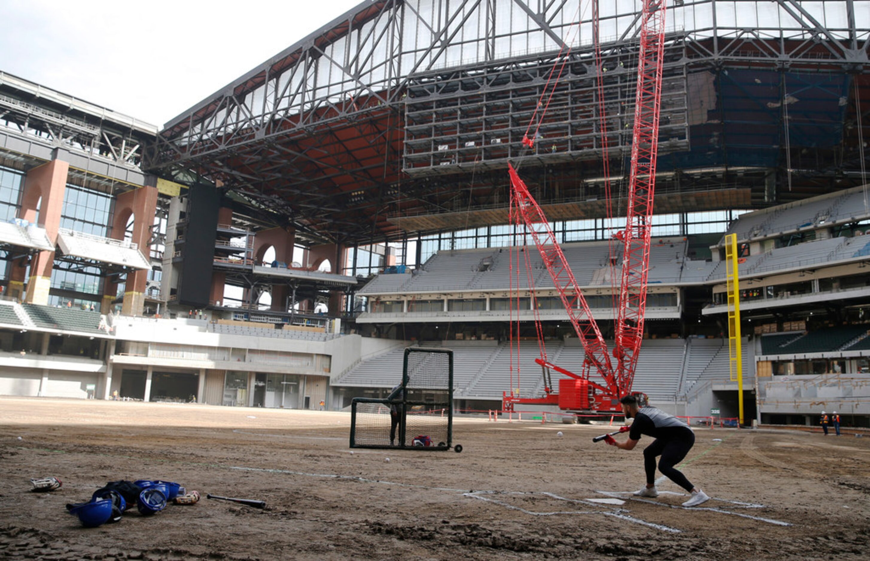 Texas Rangers Joey Gallo bunts the ball while getting some batting practice in at Globe Life...