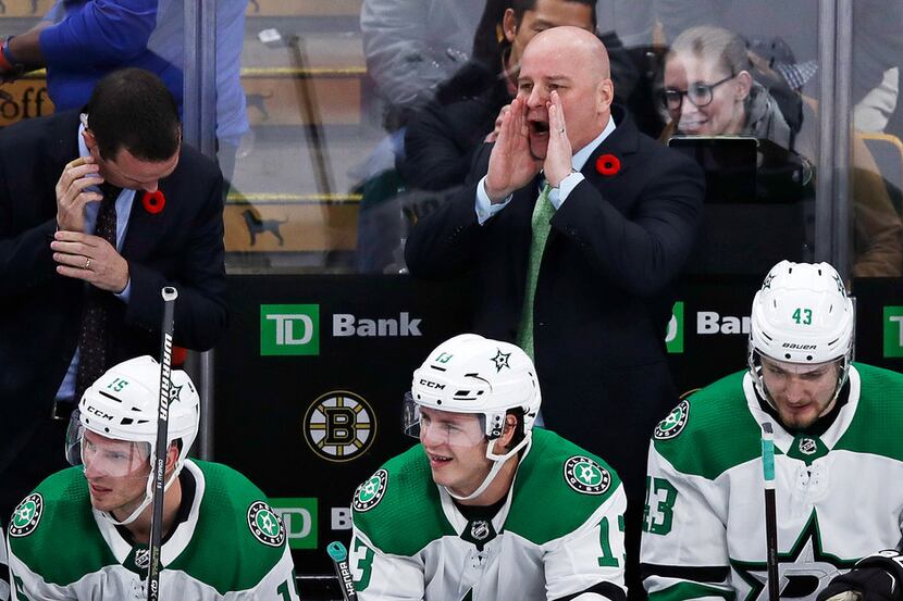 Dallas Stars head coach Jim Montgomery calls to his players during the overtime period of a...