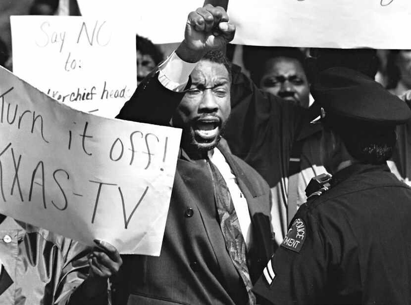 Dallas County Commissioner John Wiley Price (center) yelled during a protest at KXAS-TV on...
