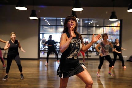 Brandi Farris group fitness director leads a Zumba class.  (Nathan Hunsinger/The Dallas...