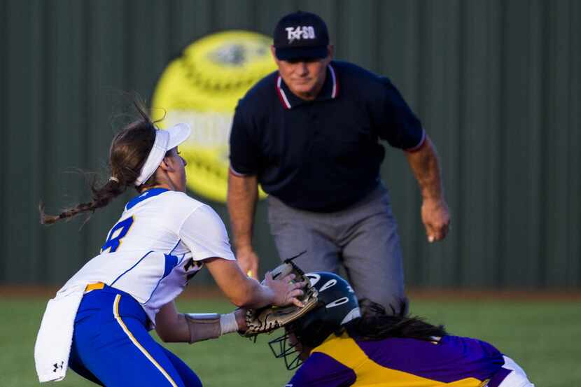 Frisco's Taylor Trosclair (8) tags out Lufkin's Yami Valdez (2) during the third inning of...