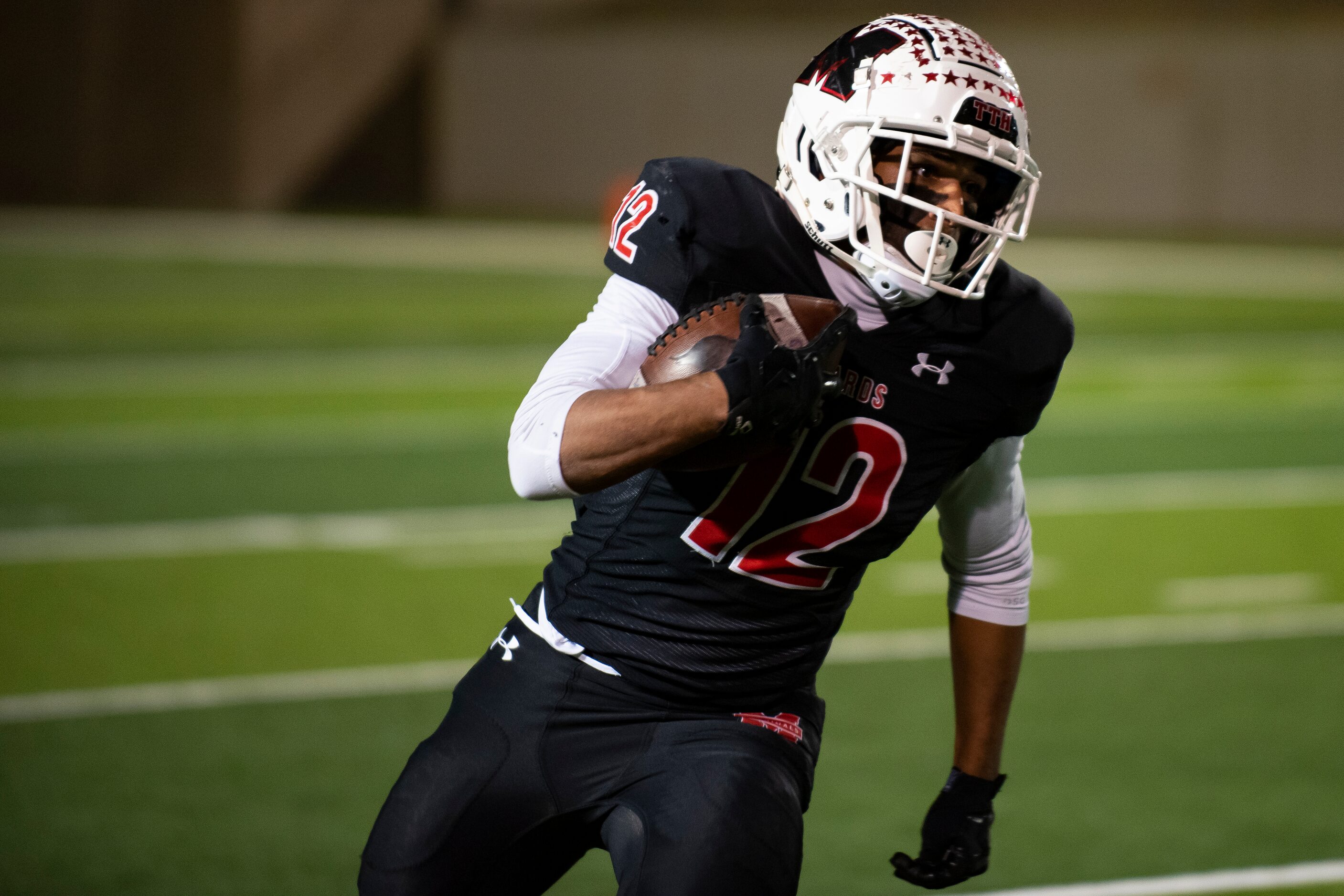 Melissa senior Ashton Mitchell-Johnson (12) rushes up the field to get a first down during...