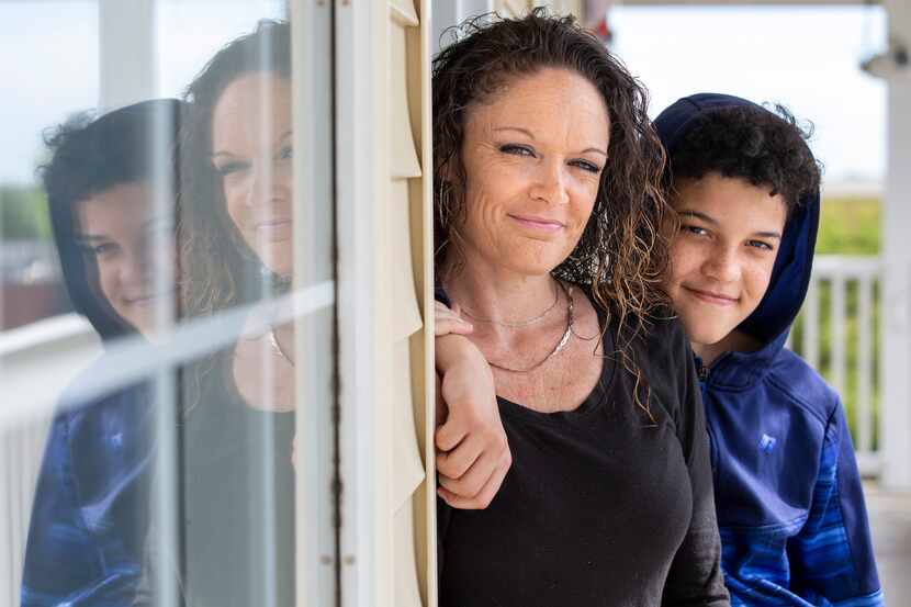 Single mother Mae Corwin (left) and her 13-year-old son Messiah Huff pose for a portrait...