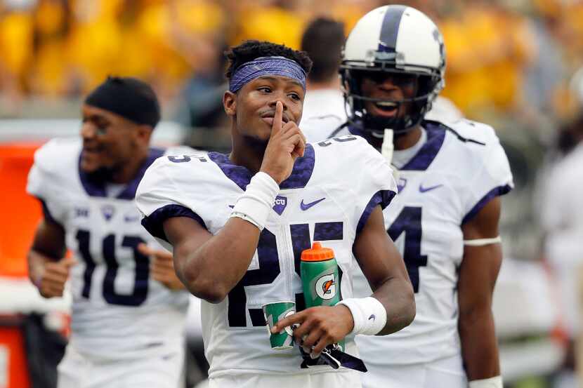 TCU wide receiver KaVontae Turpin (25) gestures his finger to his lips as he celebrates...