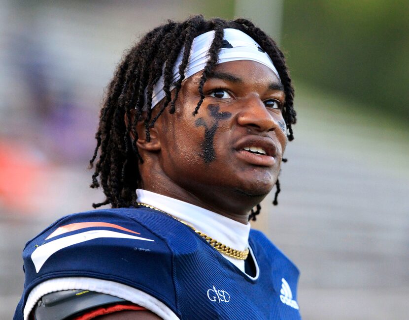 Sachse High QB Alex Orji (10) watches the defense from the sideline during the first half of...