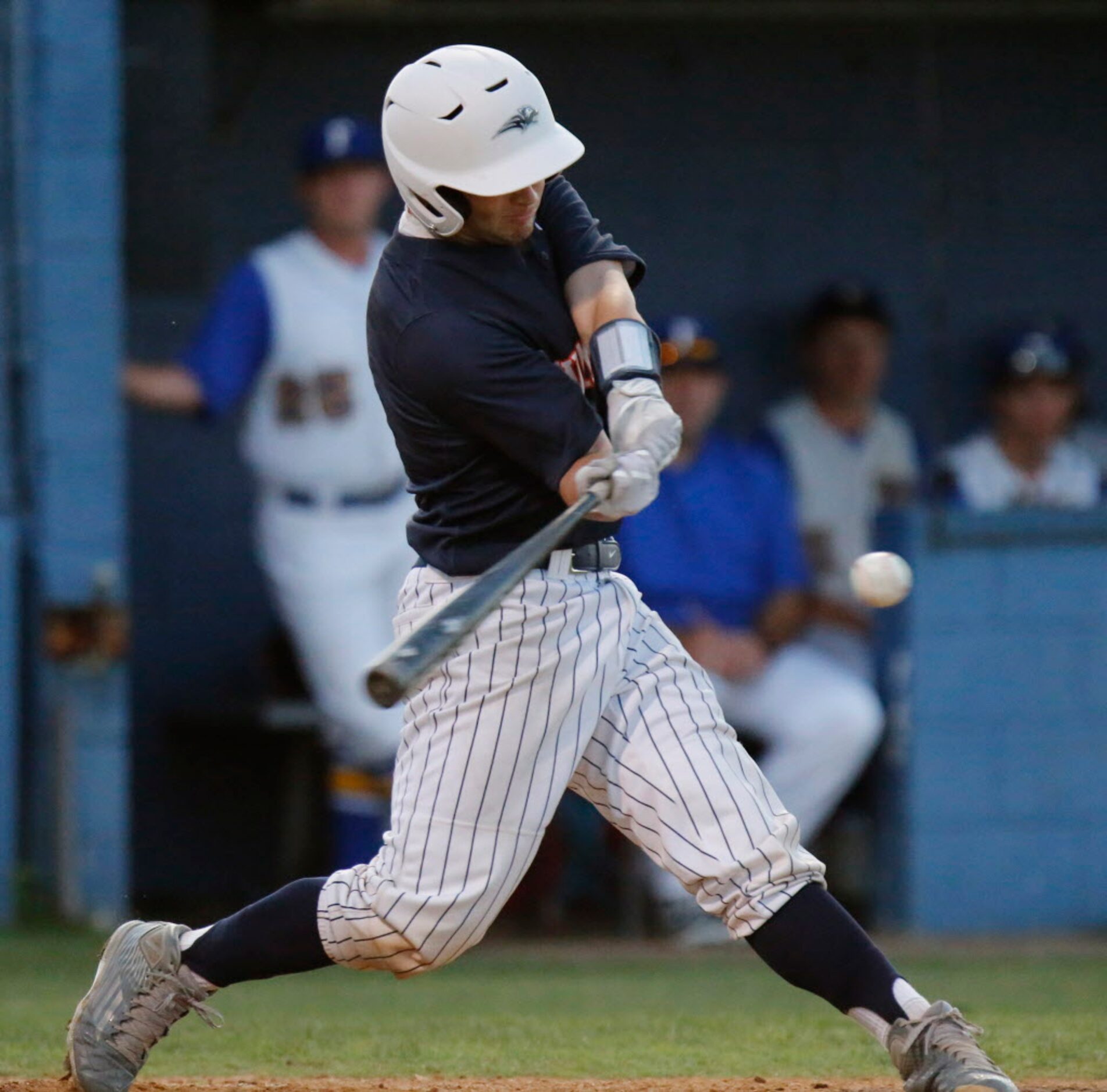 Wakeland High School catcher Jake White (9) gets a hit during the second inning as Frisco...