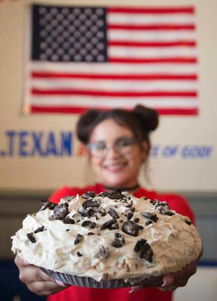 Waitress Ataly Rozo shows off a Mile-High Oreo Cream Pie at the new Norma's. 