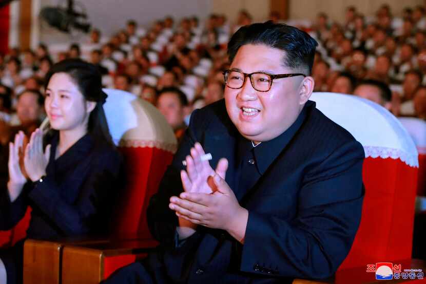 North Korean leader Kim Jong Un and his wife, Ri Sol Ju, applaud a musical performance by...