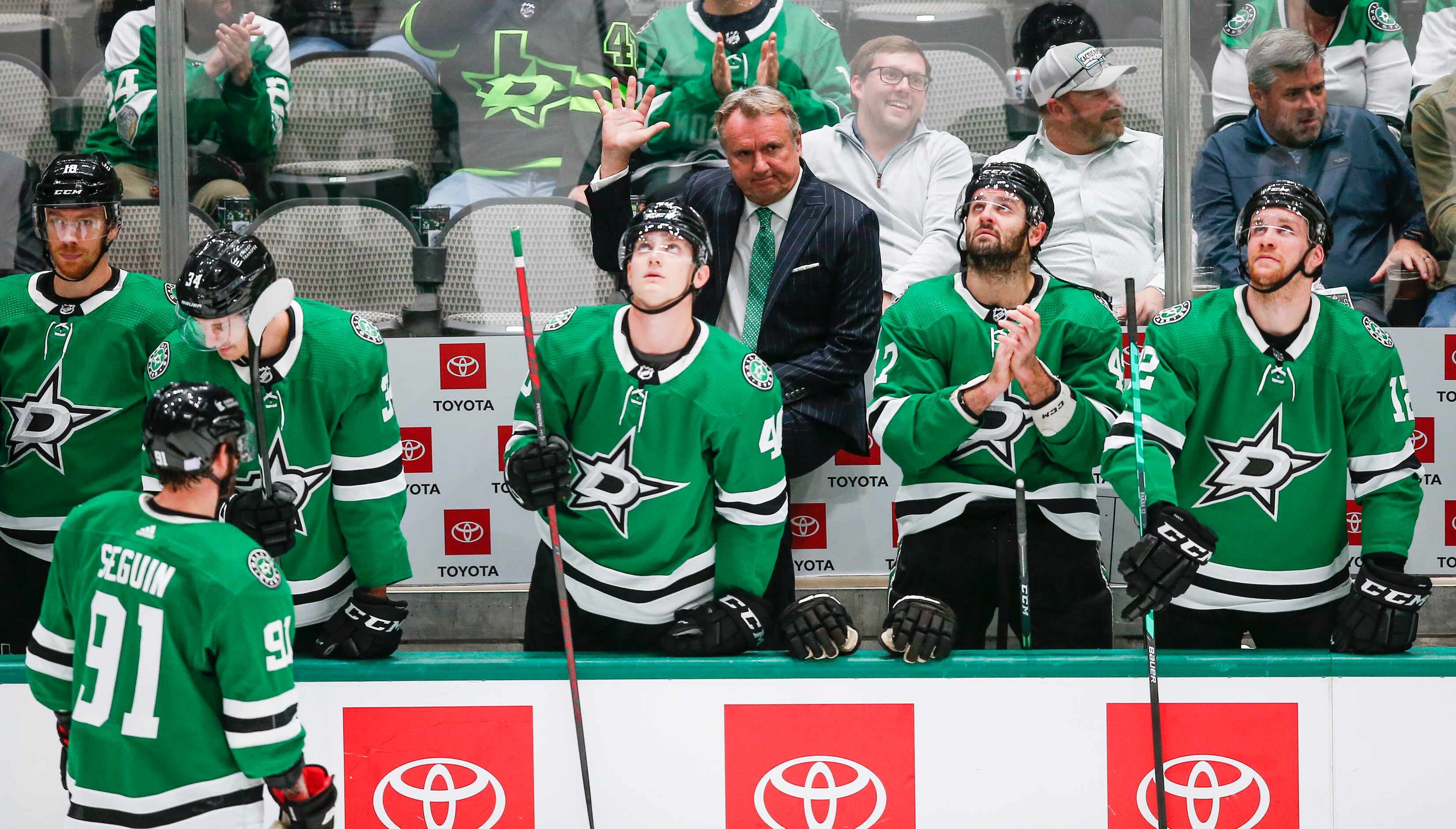 Dallas Stars head coach Rick Bowness acknowledges fans after it was announced that it was...