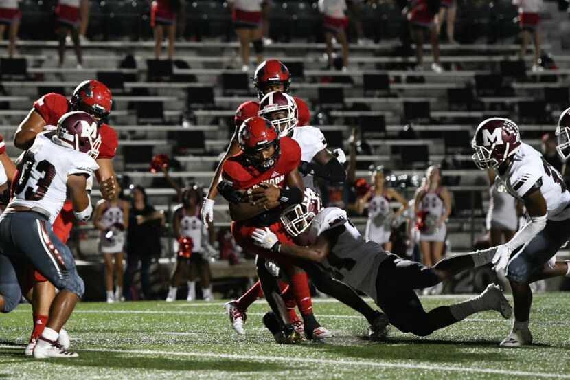 Mesquite Horn's Davazea Gabriel scores the first touchdown of the game against Mesquite...